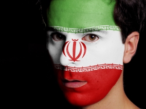 Flag of Iran Painted on a Face of a Young Man