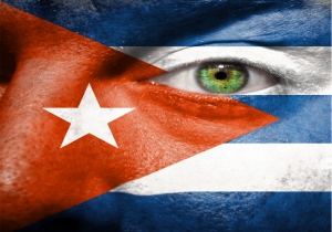 Flag painted on face with green eye to show cuba support