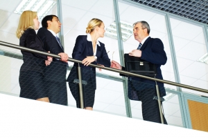 Group of businesspeople and their senior boss interacting